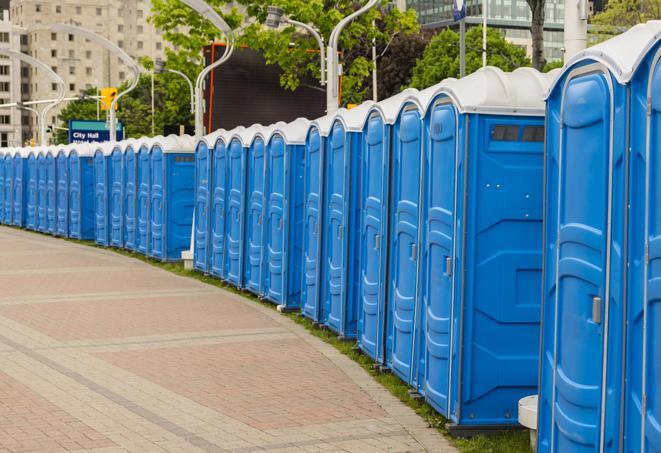 a row of portable restrooms set up for a large athletic event, allowing participants and spectators to easily take care of their needs in Holladay UT